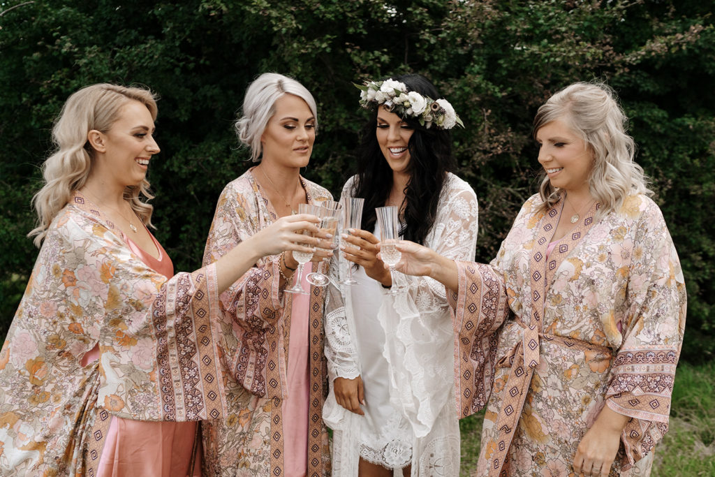 Bridesmaids toasting their bride
